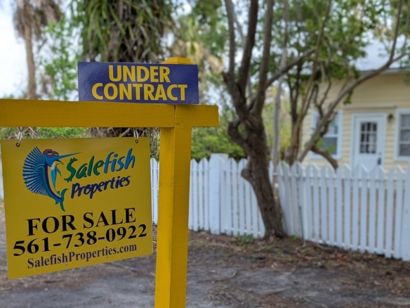 521 SW Halpatiokee Street home with white picket fence under contract