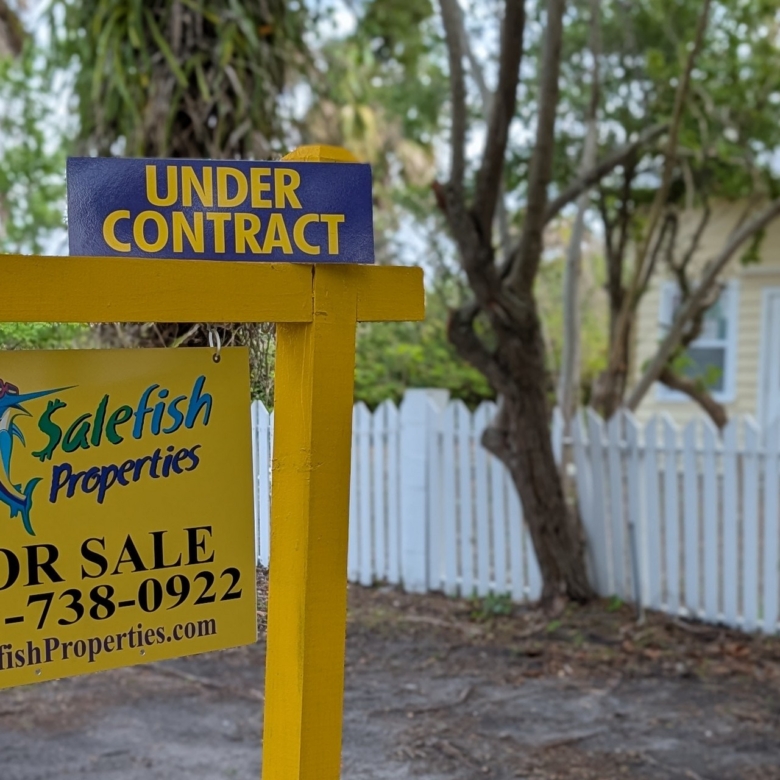 521 SW Halpatiokee Street home with white picket fence under contract