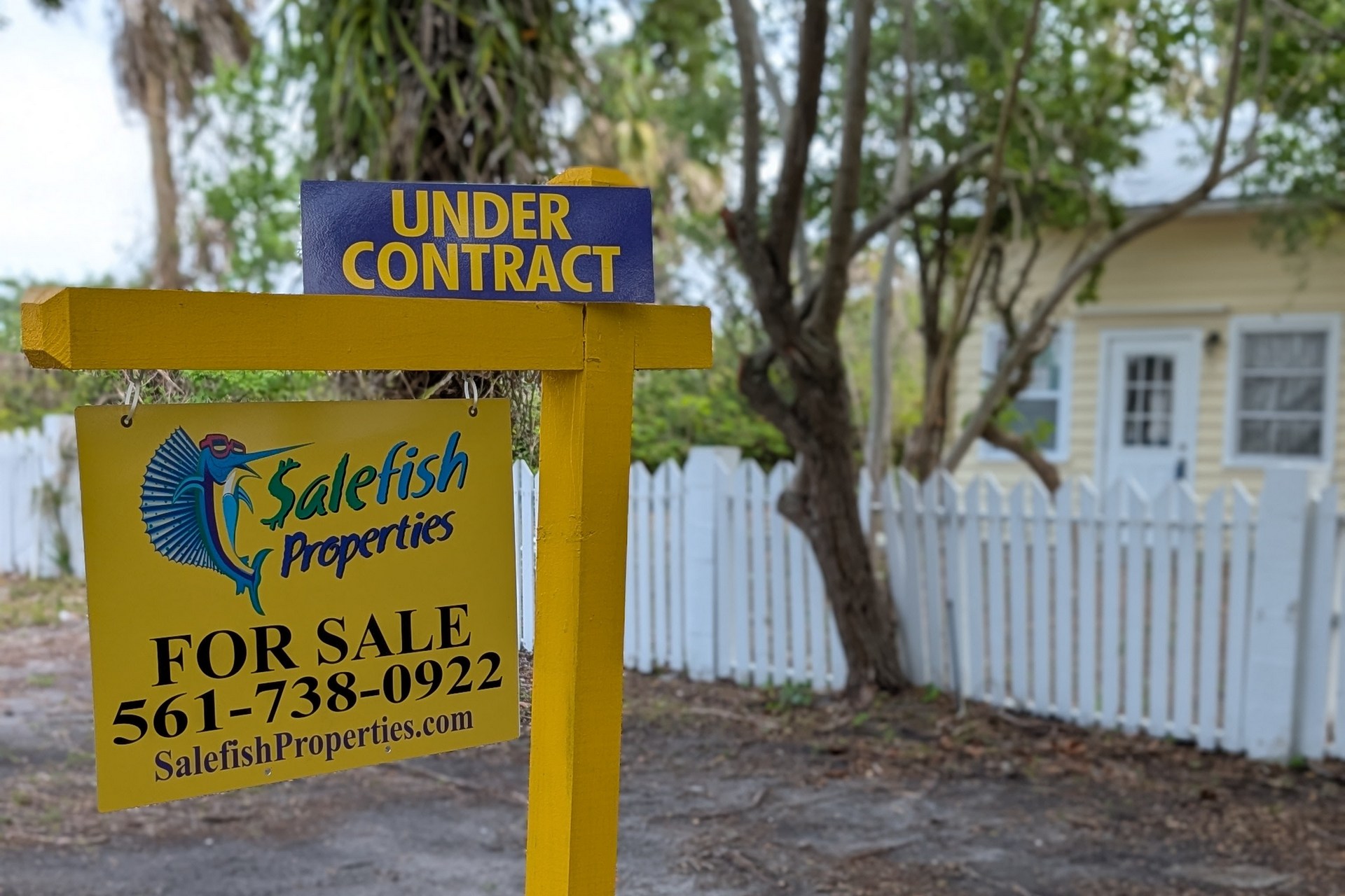 521 SW Halpatiokee Street home with white picket fence under contract