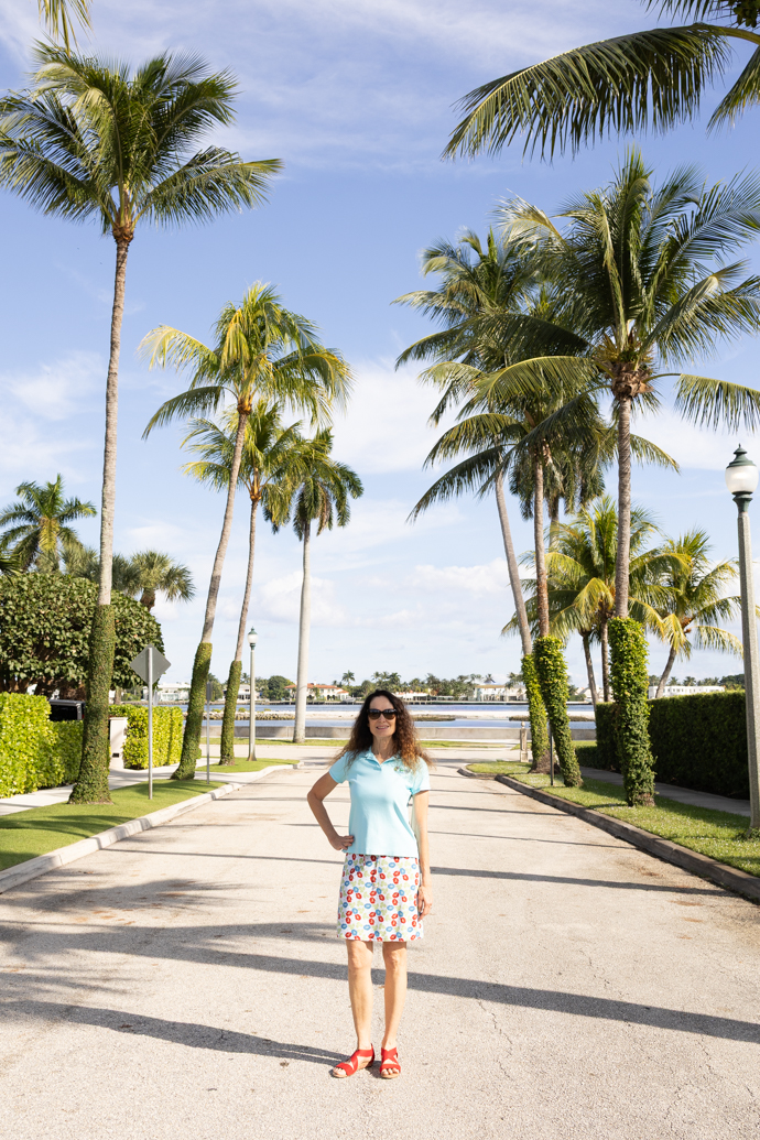Nancy Jackson realtor standing under palm trees
